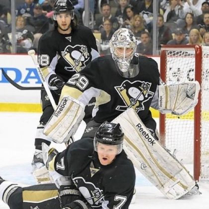Penguins defenseman Paul Martin makes a save in front of goalie Marc-Andre Fleury.