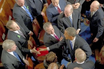 Sen. Toomey, left, shakes hands with President Barack Obama after Mr. Obama delivered the State of the Union address Tuesday in the House of Representatives.