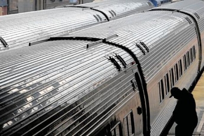 A man boards the Pennsylvanian, an Amtrak passenger train line that runs between Pittsburgh and Philadelphia, at a stop in Harrisburg on Wednesday. The state must decide by October whether to keep the Pittsburgh-to-Harrisburg route.