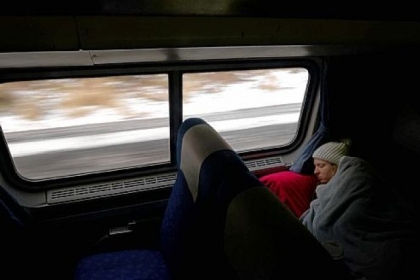 Christy Gressman of Murrysville, a passenger aboard Amtrak's Pennsylvanian passenger train, catches up on some sleep Wednesday while traveling between Pittsburgh and Philadelphia.  The Pennsylvanian is the only passenger train that has a daily route between the state's two largest cities. The service is in danger of being cut in October.