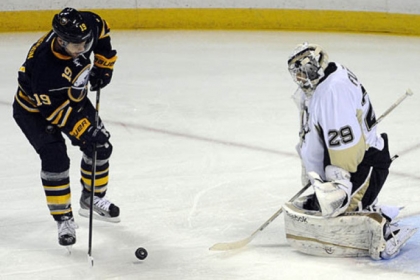 Buffalo Sabres center Cody Hodgson shoots the puck against Penguins goaltender Marc-Andre Fleury during the first period of an NHL hockey game in Buffalo, N.Y.