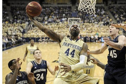 Pitt forward J.J. Moore drives to the net against Notre Dame in the first half at the Petersen Events Center Monday.