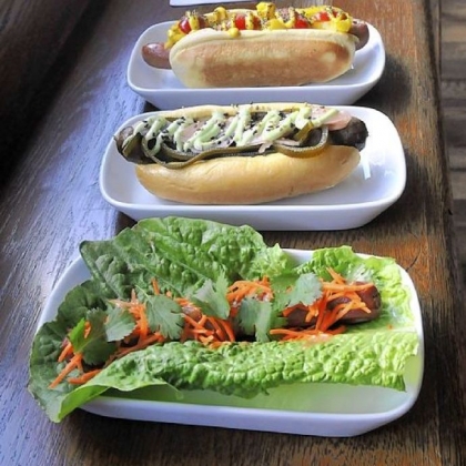 Front to back: the Bangkok, Negishi and Chicago Impostor hot dogs at Franktuary in Lawrenceville, with the drinks Holy Cow (left) and Flying Nun.