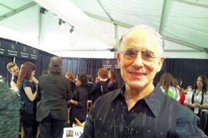 Philip Pelusi backstage at Mercedes-Benz Fashion Week Feb. 9 at Lincoln Center on Manhattan's Upper West Side. He and a team of stylists designed a Parisian-inspired hairstyle for models in the Venexiana runway show.
