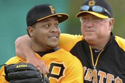 Pirates manager Clint Hurdle sneaks up on infielder Anderson Hernandez at drills Feb. 14 at Pirate City, in Bradenton, Fla. Hurdle, entering the final year of his contract, is expected to receive an extension through 2014 with a club option for 2015.