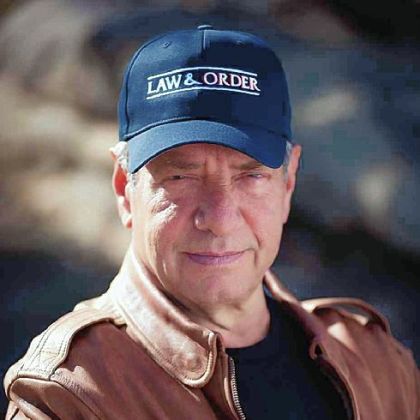 As an author, Dick Wolf "uses many of the same devices he deploys so effectively on TV."