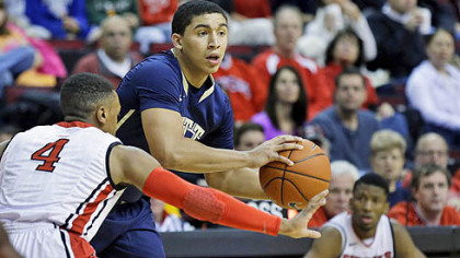 James Robinson looks to pass in front of Myles Mack during the first half.