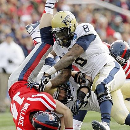 Todd Thomas, right, and Joe Trebitz upend Mississippi quarterback Bo Wallace.