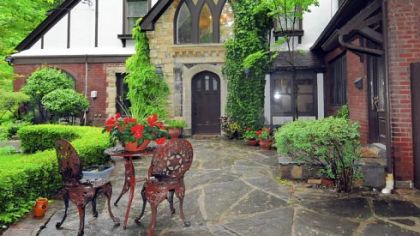 A Tudor at 300 7th St. Ext. in Patterson Heights, Beaver County, was for sale for $359,000 but couldn't find a buyer so it was taken off the market. Above is the home's rear exterior with patio.