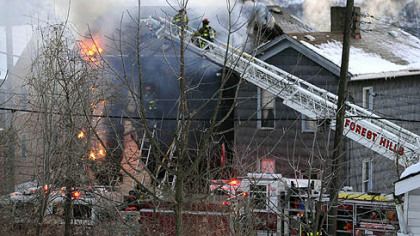 Fireman battle a fire near the intersection of Rebecca Avenue and Thirteenth Street in North Braddock where Three-year-old twins died.