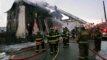 Fireman from numerous companies battle a fire on Rebecca Ave. in North Braddock where infant twin boys died.
