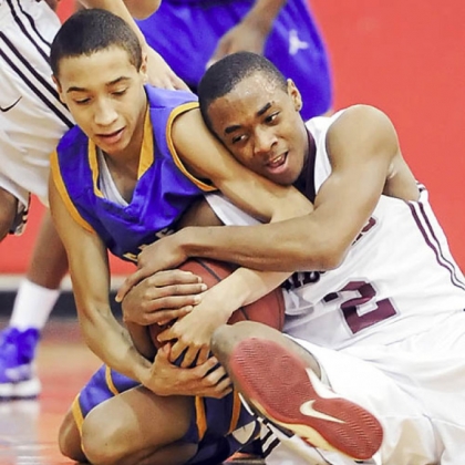 East Allegheny's Jordan Williams fights for a loose ball against Ambridge's Stephon McGinnis.