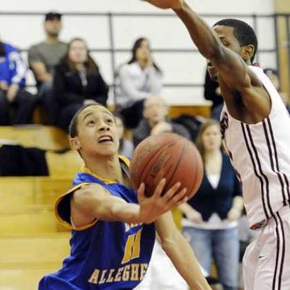 East Allegheny's Jordan Williams scoops up a shot against Ambridge's Khalil Tookes.