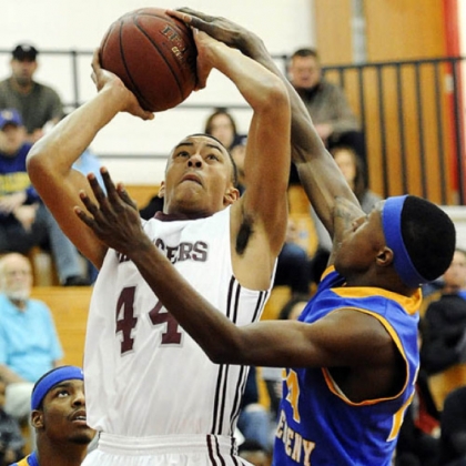 Ambridge's Keenan Baker drives to the net against East Allegheny's Joel Randolph.