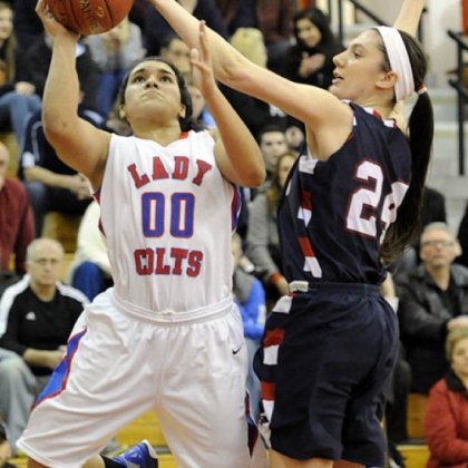 Chartiers Valley High School's Mariah Wells has her shot blocked by Shaler's Andrea Lydon in a girls basketball game Friday night.