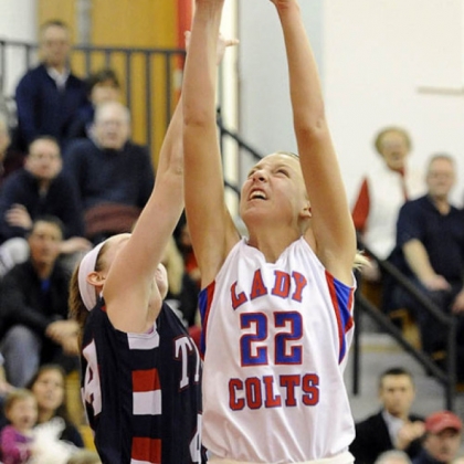 Chartiers Valley's Kristina Coyne reaches for a rebound against Shaler's Abby Conrad.
