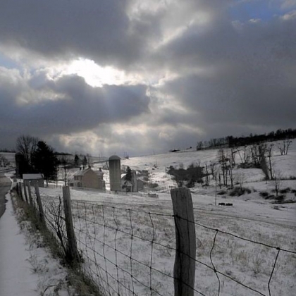 The sun peeks out over a farm scene along Davis School Road in South Strabane, Washington County.