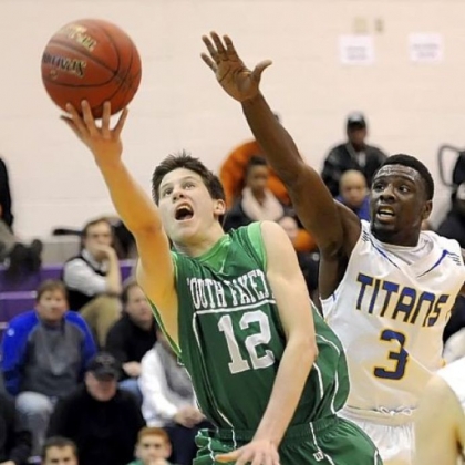South Fayette's Evan Bonnaure drives to the basket against West Mifflin's Derrick Fulmore in a Class AAA game Tuesday.