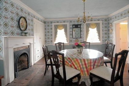Dining room exudes charming decor found throughout house.