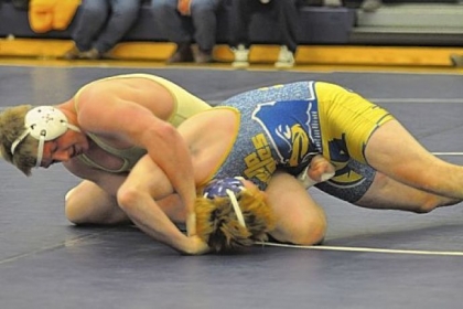 Hopewell's Michael Tempalski, left, pinned Avella's Zack Simonelli during their finals match of the Burgettstown Tournament.