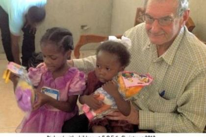 Richard Spear with children in Haiti.