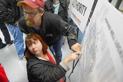 John and MaryBeth Sinagoga of Imperial in Findlay, look over a map of proposed well sites during an open house Monday, sponsored by the Allegheny County Airport Authority and Consol Energy to discuss proposed Marcellus Shale gas drilling at Pittsburgh International Airport. The county approved the plan Tuesday.