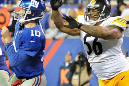 Steelers outside linebacker LaMarr Woodley knocks ball out of Giants quarterback Eli Mannings hands during a game last season.