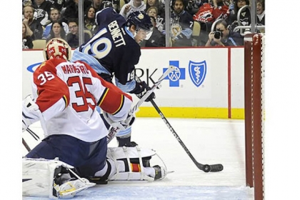 Penguins' Beau Bennett tries to get a shot in behind Panthers goaltender Jacob Markstrom in the first period at Consol Energy Center Friday night.