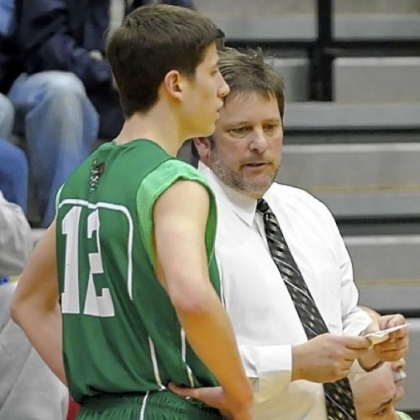 South Fayette coach Rich Bonnaure talks to his son, Evan, during a playoff victory against West Mifflin Tuesday at Baldwin.