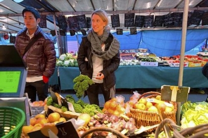 Sewickley native Kristen Beddard (right) of The Kale Project at a market in Paris.