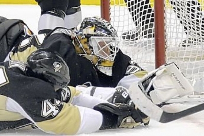 Penguins defenseman Brooks Orpik and goaltender Tomas Vokoun try to stop a goal by the Flyers' Jakub Voracek in a loss Wednesday at Consol Energy Center.