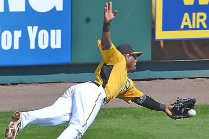 The Pirates' Starling Marte stretches out for a ball during the Pirates' Black and Gold game this afternoon at McKechnie Field in Bradenton, Fla.