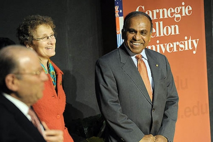 CMU president Jared Cohon, left, jokes with president-elect Subra Suresh, right, as Mr. Suresh makes his first public visit to the university on Thursday with his family, including his wife, Mary, center.