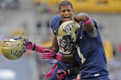 Former Pitt star Ray Graham is congratulated by Devin Street after scoring a touchdown against Temple for the Panthers last season.
