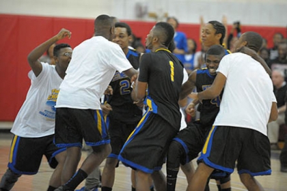 Members of Pittsburgh's Westinghouse High School basketball team celebrate their victory over Pittsburgh's Perry High School to win the City Championship today.