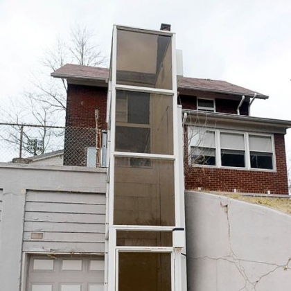 The home is handicapped-accessible and comes with an outdoor elevator lift attached to the three-car garage on a lower level.