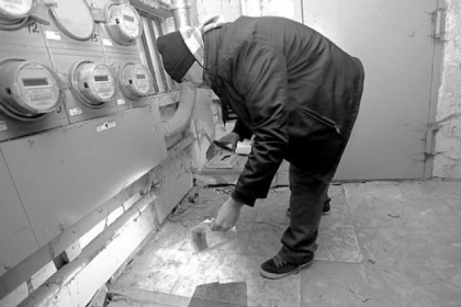 Exterminator Manuel "Junior" Medina inspects a basement for rats in Manhattan's Lower East Side.