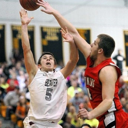 Kittanning's Vince Mead blocks the shot of Beaver's Austin Logan Friday. Logan finished with 36 points in Beaver's 71-66 victory.
