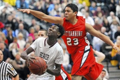 Beaver forward Corey Nesmith scores against Kittanning's Kevin Barnes in the first half Friday.