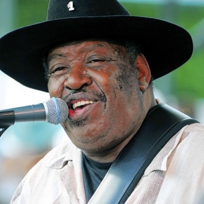 In this July 5, 2009, file photo, Bluesman Magic Slim performs with his band the Teardrops on the final day of the Waterfront Blues Festival in Portland, Ore.