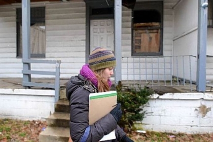 Marlee Gallagher of Wilkinsburg walks along Wallace Avenue trying to collect signatures on a petition to put the liquor license question on the ballot in the dry borough.