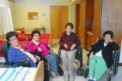 In this Feb. 7 photo, the four Foran sisters, from left, Marie, 86, her twin sister Dolores, 86, Rita, 93, and Helen, 91 pose in the Golden Living Center-York Terrace nursing home in Pottsville, Pa.