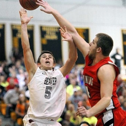 Kittanning's Vince Mead blocks the shot of Beaver's Austin Logan Friday. Logan finished with 36 points in Beaver's 71-66 victory.