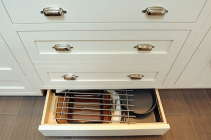 Kick-plate drawers along the floor open at the touch of a hand or toe.