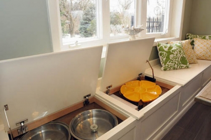 The window box seats at the kitchen table offer additional low-level storage.