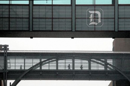 Students cross the pedestrian bridge from the "Power Center" to the main campus of Duquesne University Friday. Classes were cancelled for the day.
