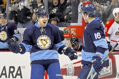 Matt Niskanen celebrates his third-period goal against the Panthers with Brandon Sutter Friday at Consol Energy Center.