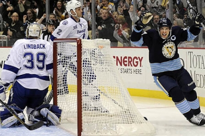Penguins' Sidney Crosby celebrates his goal in the first period.