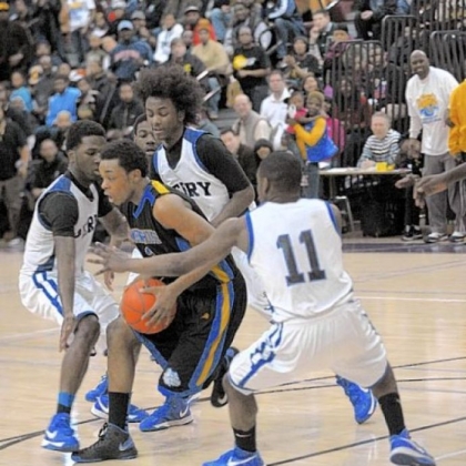 Perry defenders swarm Westinghouse's DaSonte White.