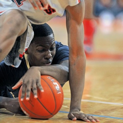 Pitt's Tray Woodall, bottom, and St. John's Phil Greene fight for a loose ball Sunday.
